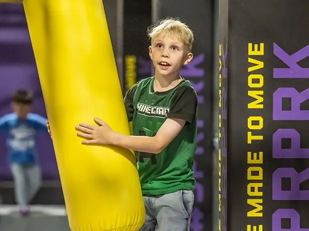 Young boy enjoys the Ninja Track at SuperPark Melbourne