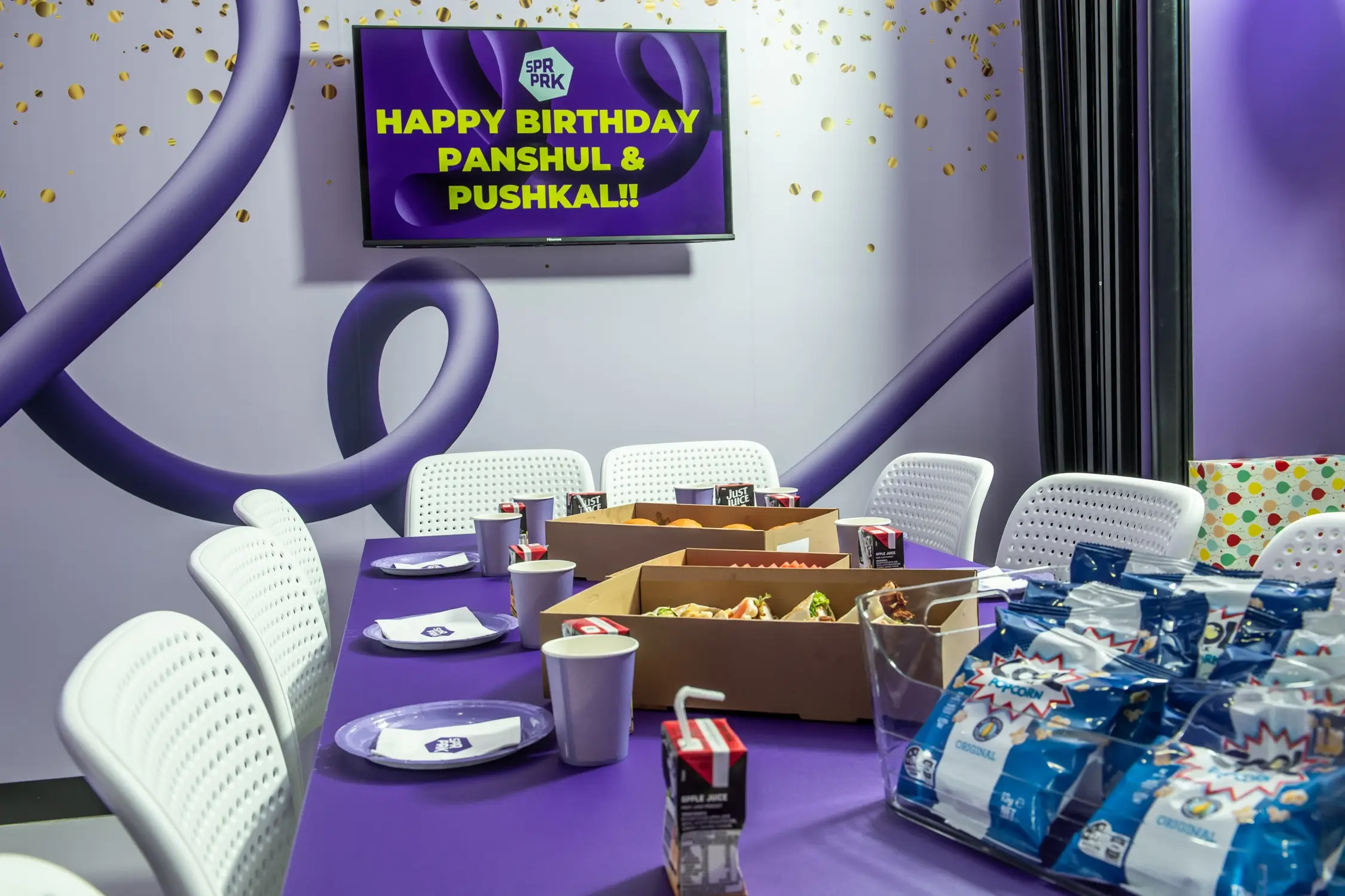 Birthday party table with television in background