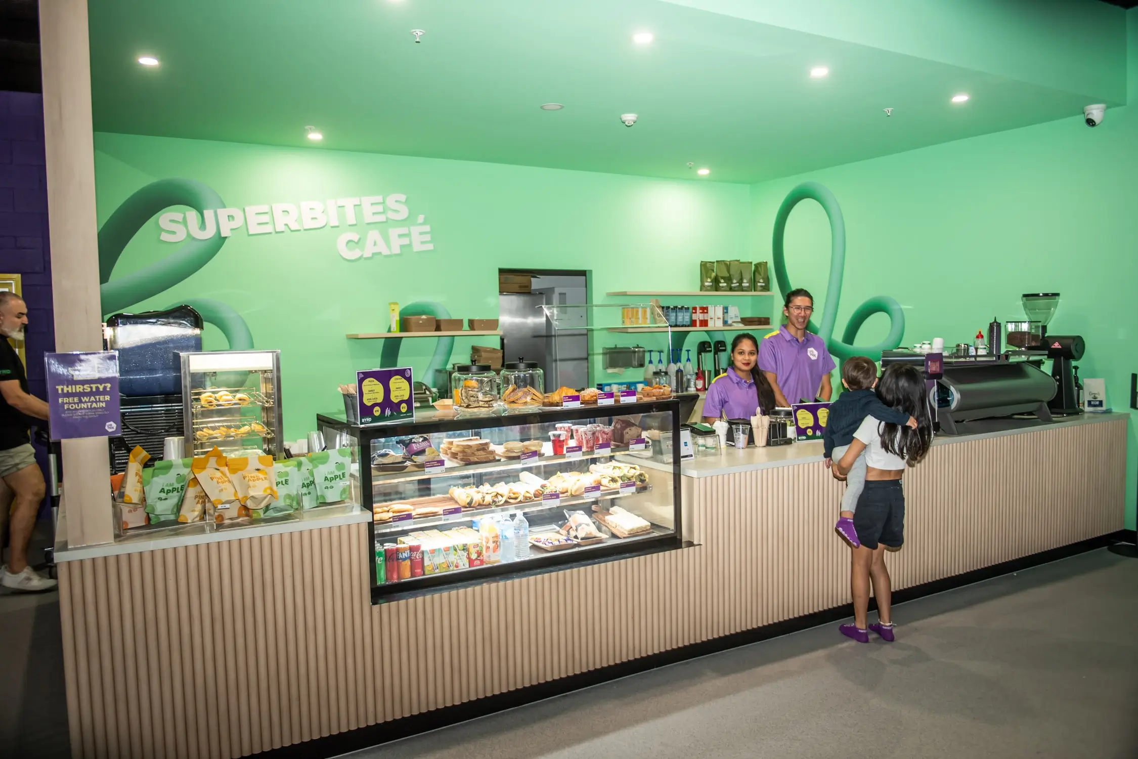 Friendly staff serving healthy meal options at the SuperPark cafe