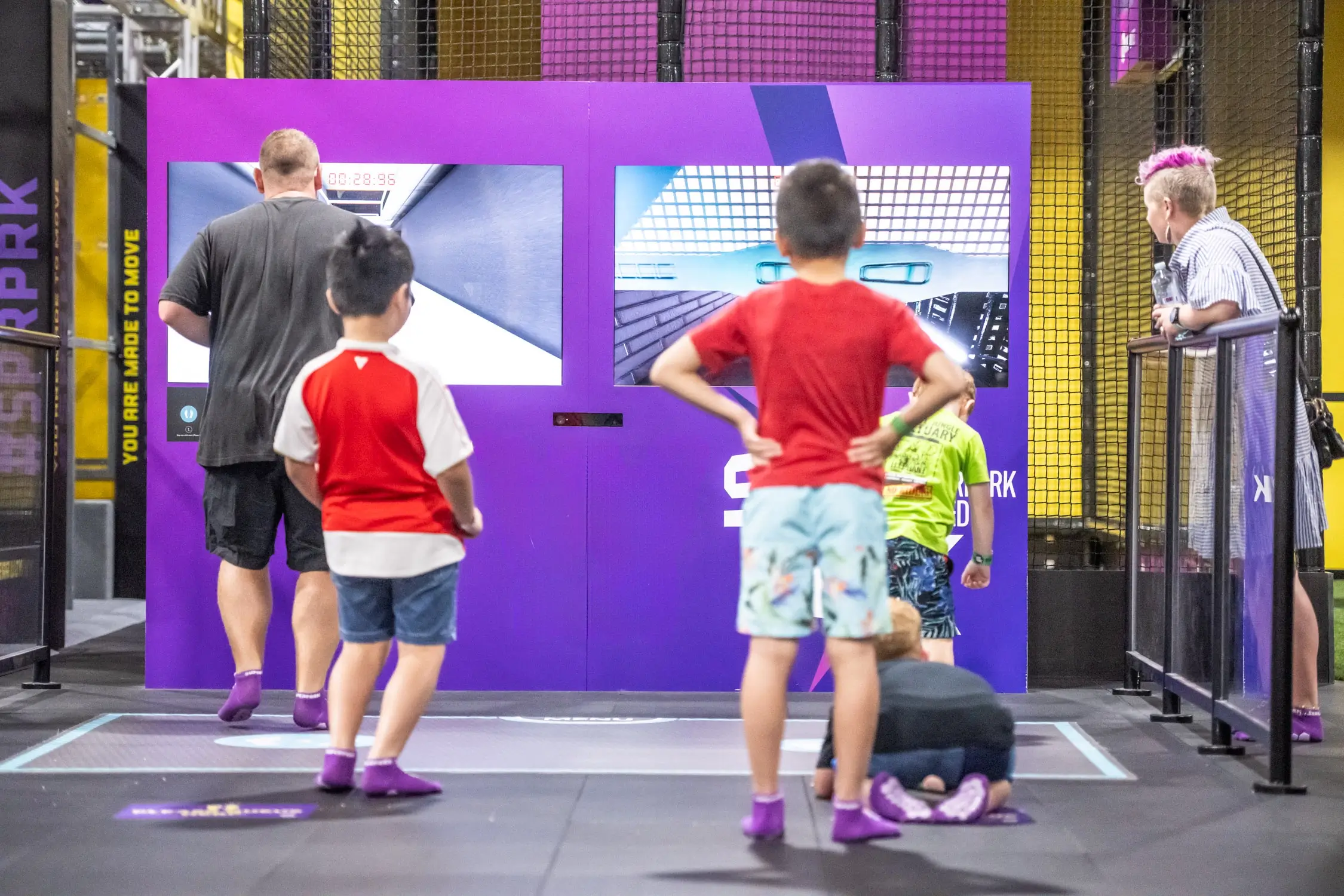 Kids and parents play together at indoor play centre