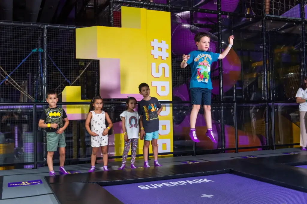 Kids play on the SuperJump trampolines for school holiday fun