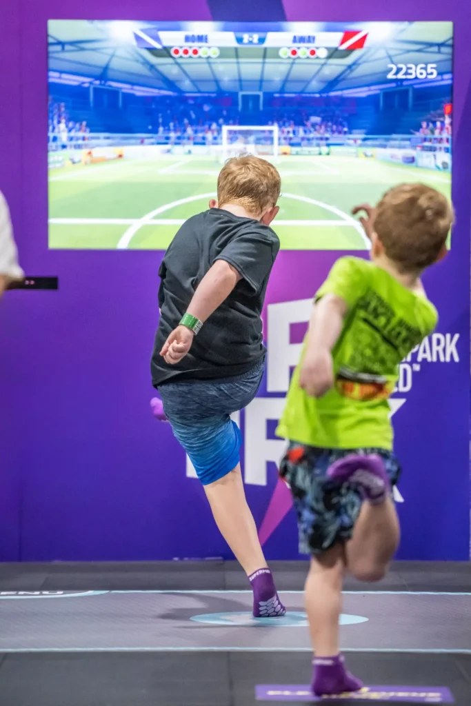 Kids play on the slides at SuperPark, an indoor playground