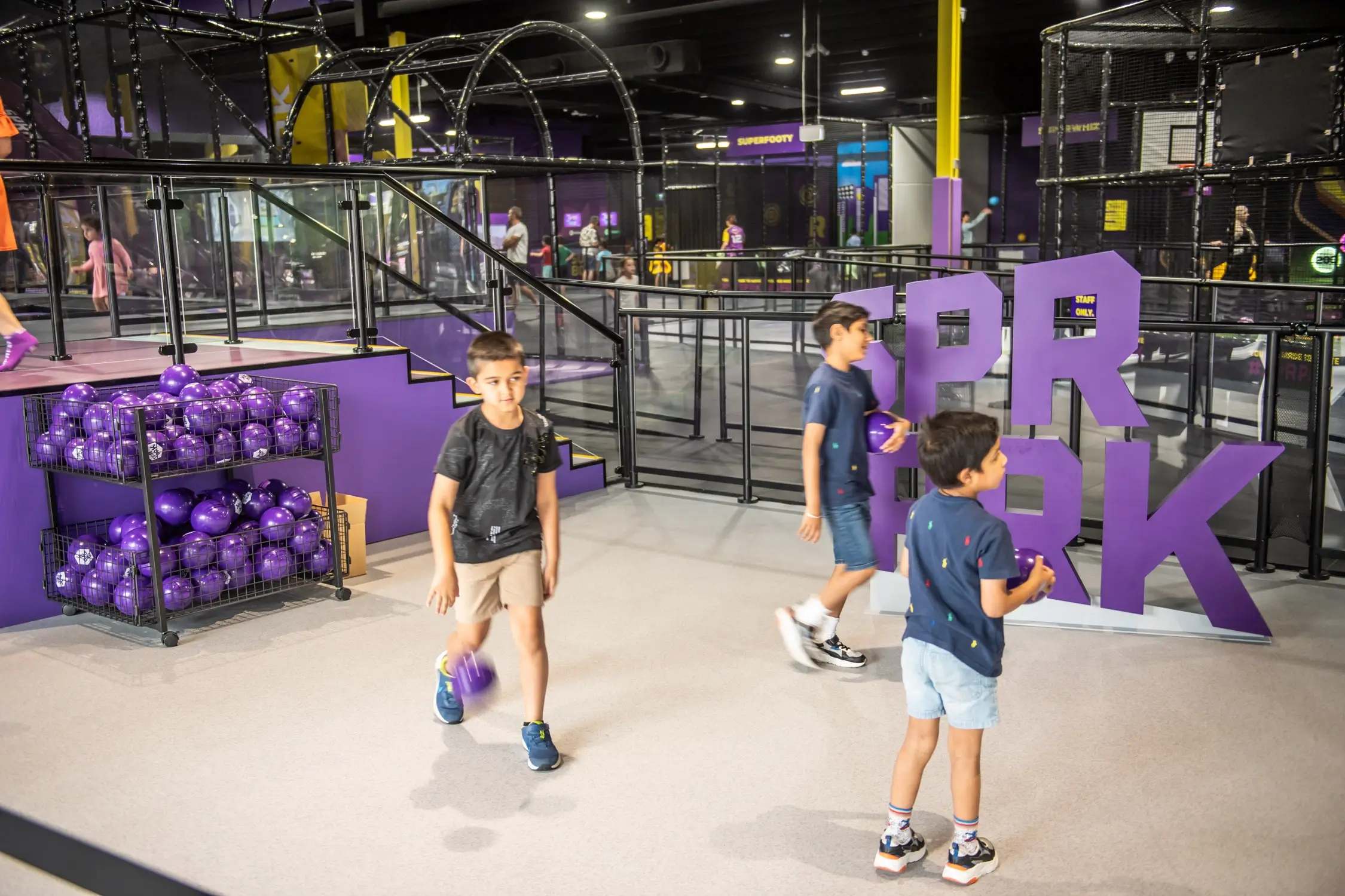 A group of young kids team up to play at SuperPark