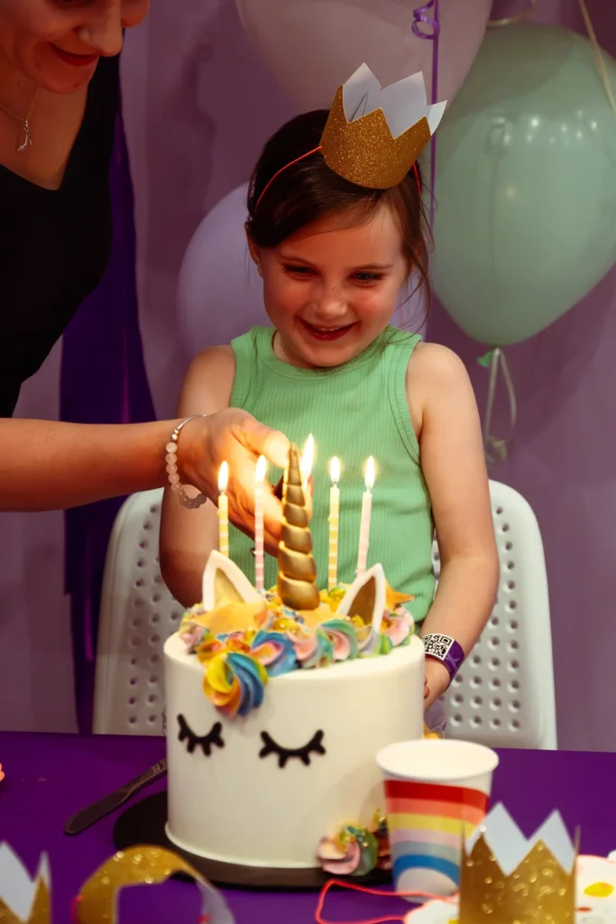 Girl enjoying birthday cake